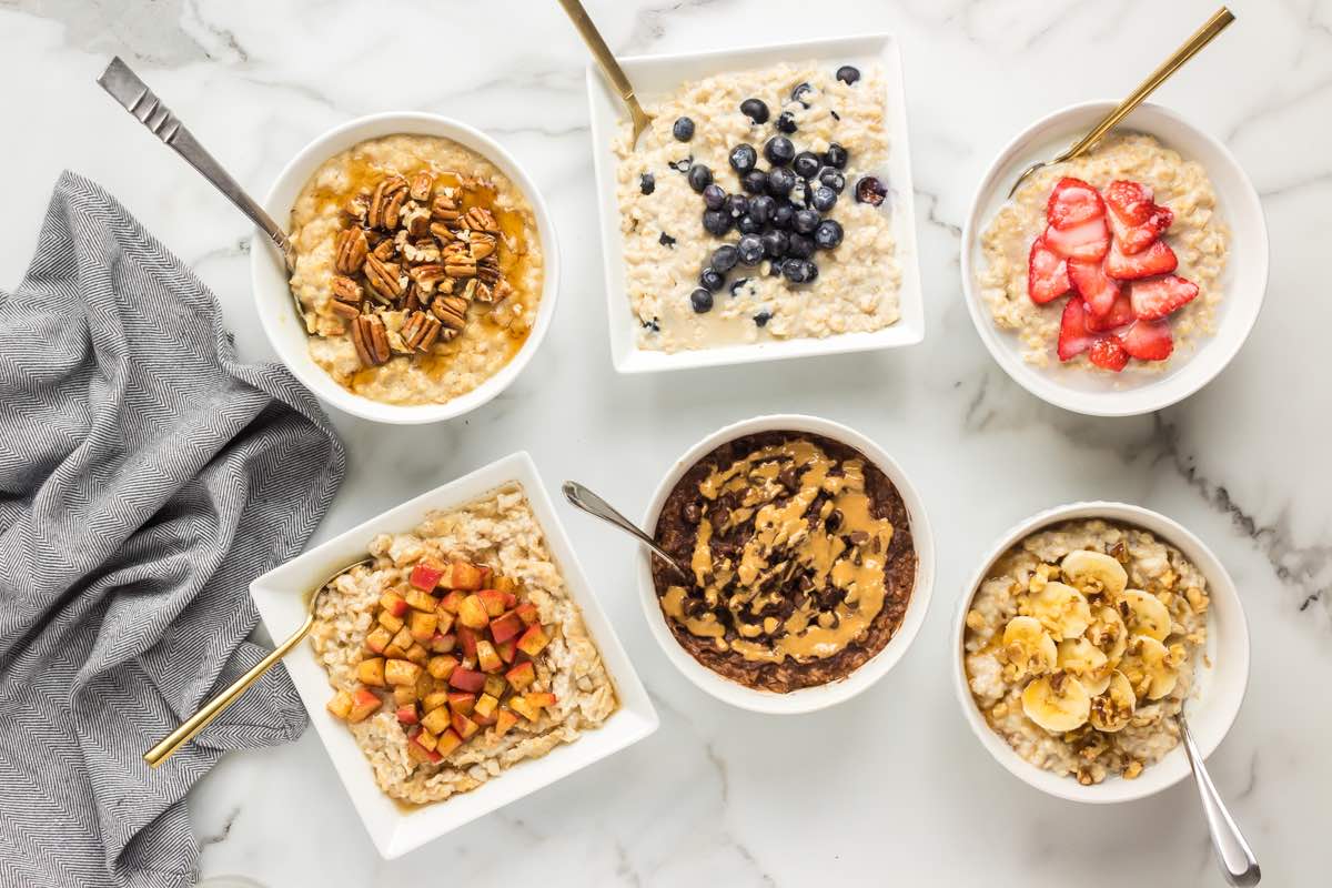 bowls of protein oats with toppings.