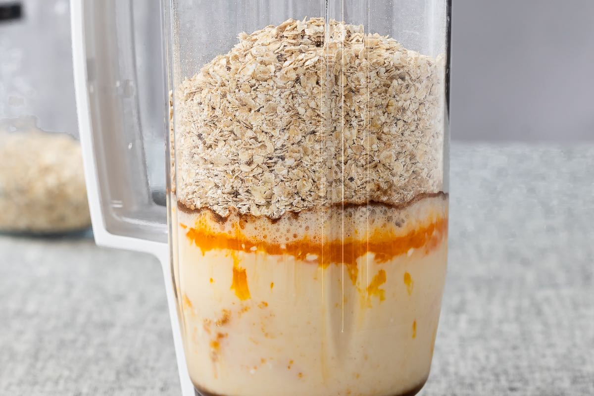 oats, pumpkin, coconut oil, milk, and baking powder in a blender.