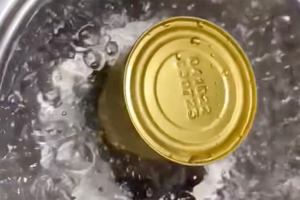 cans in boiling water.