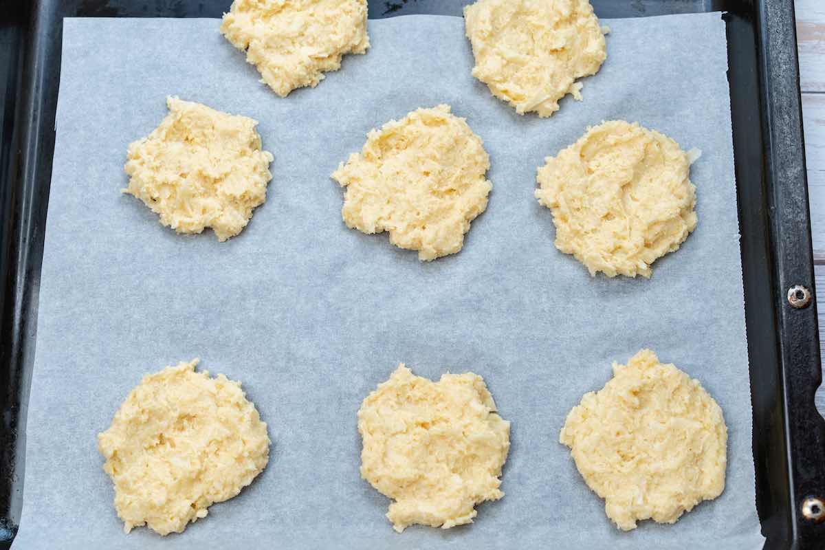 dropped keto biscuits on a baking sheet.