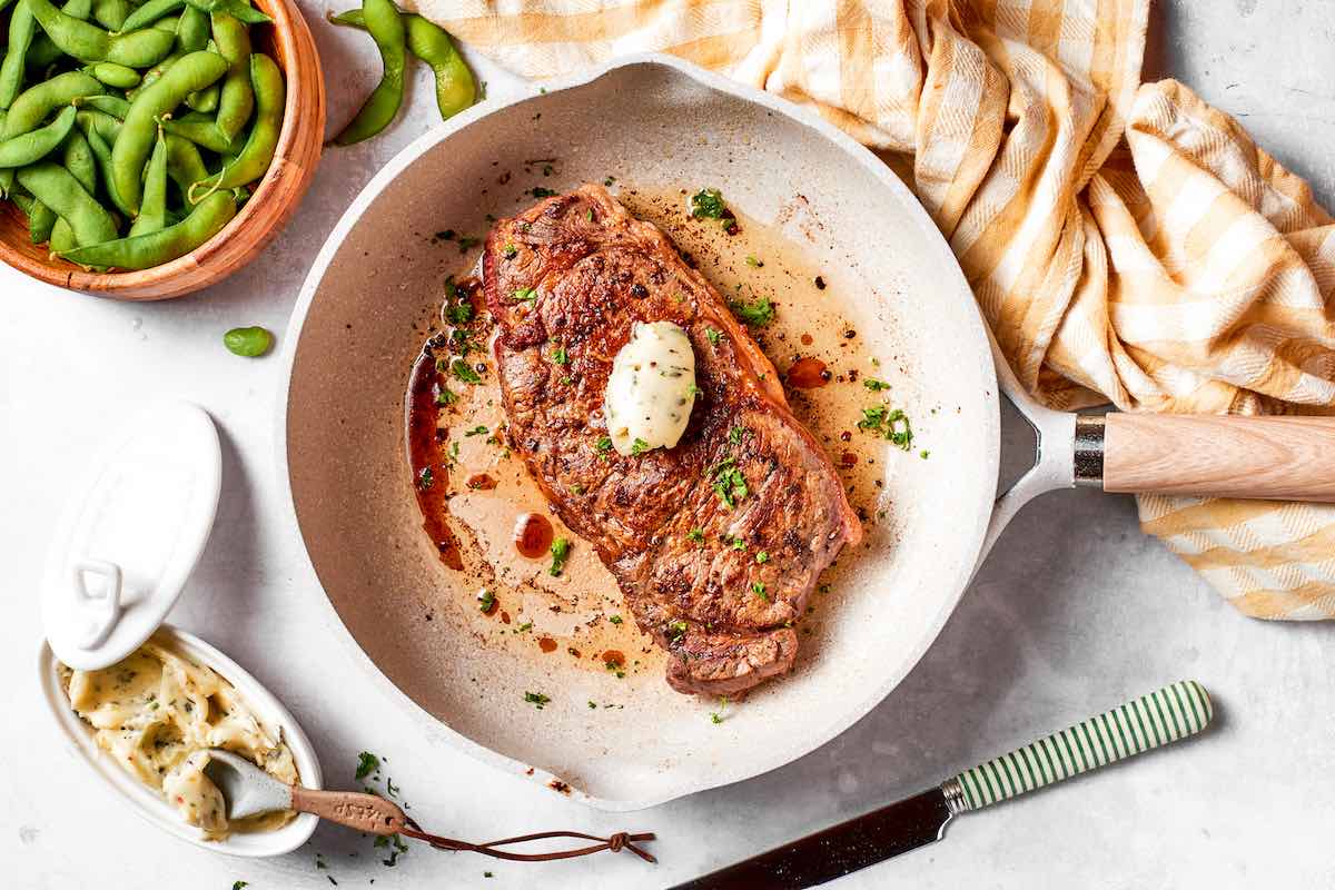 pan-seared shoulder steak with garlic butter on top.