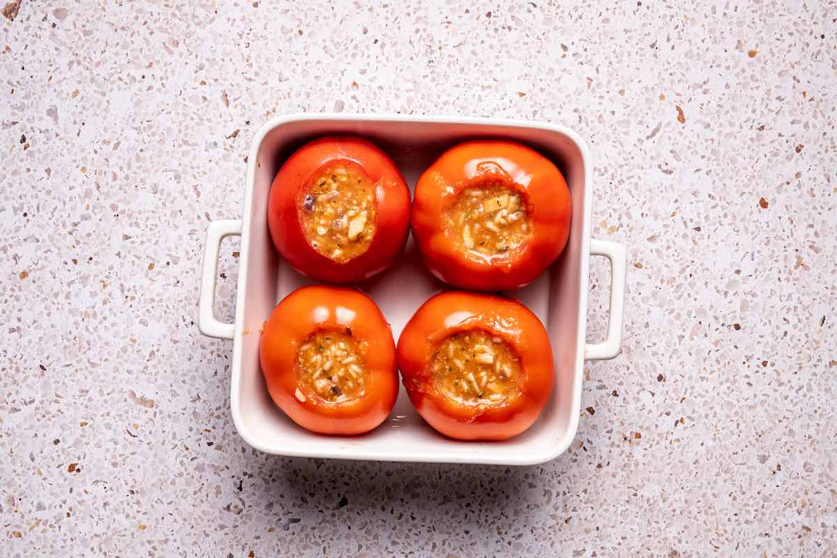 scooped out tomatoes in a baking dish.