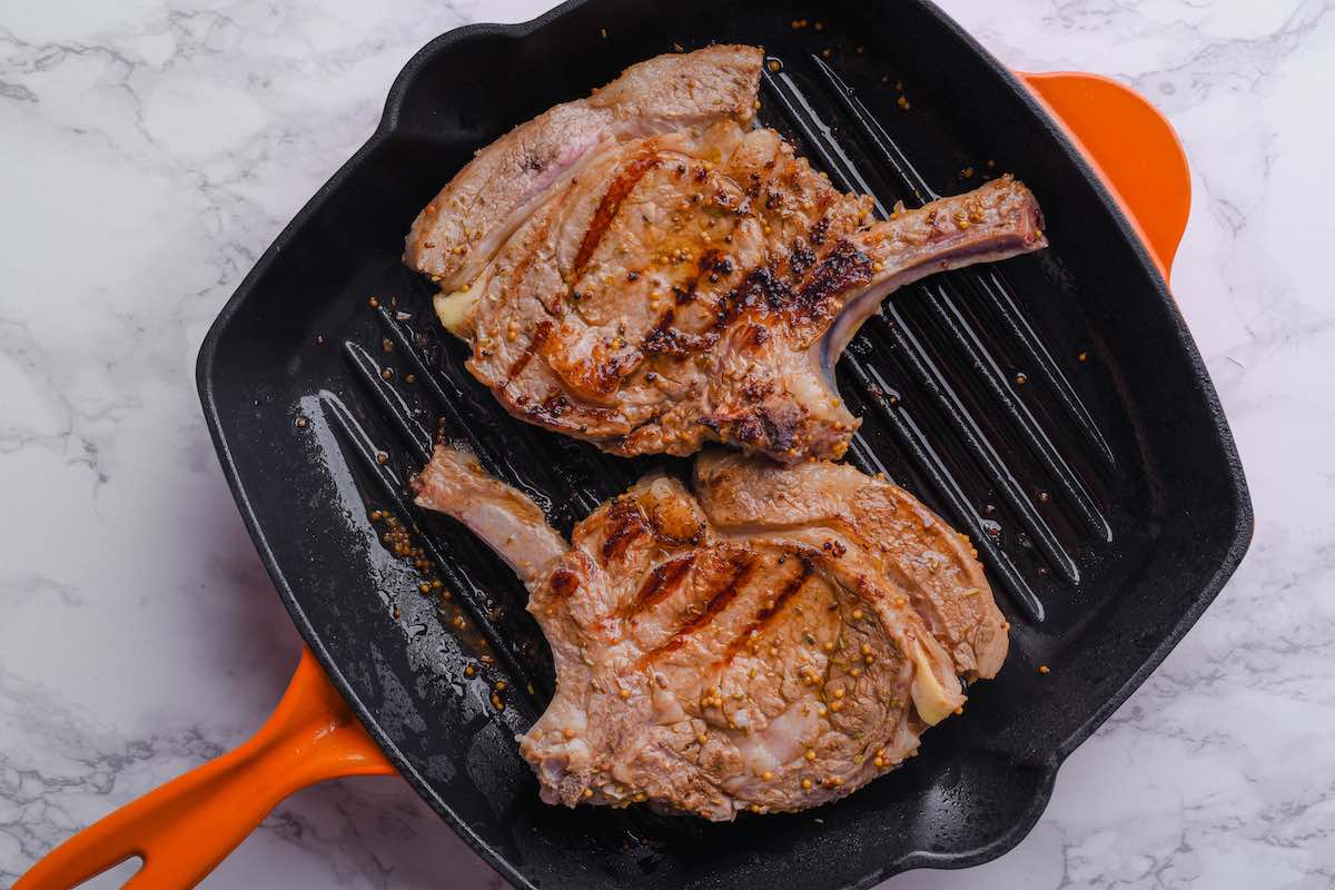 pan-searing veal chops on a grill pan.