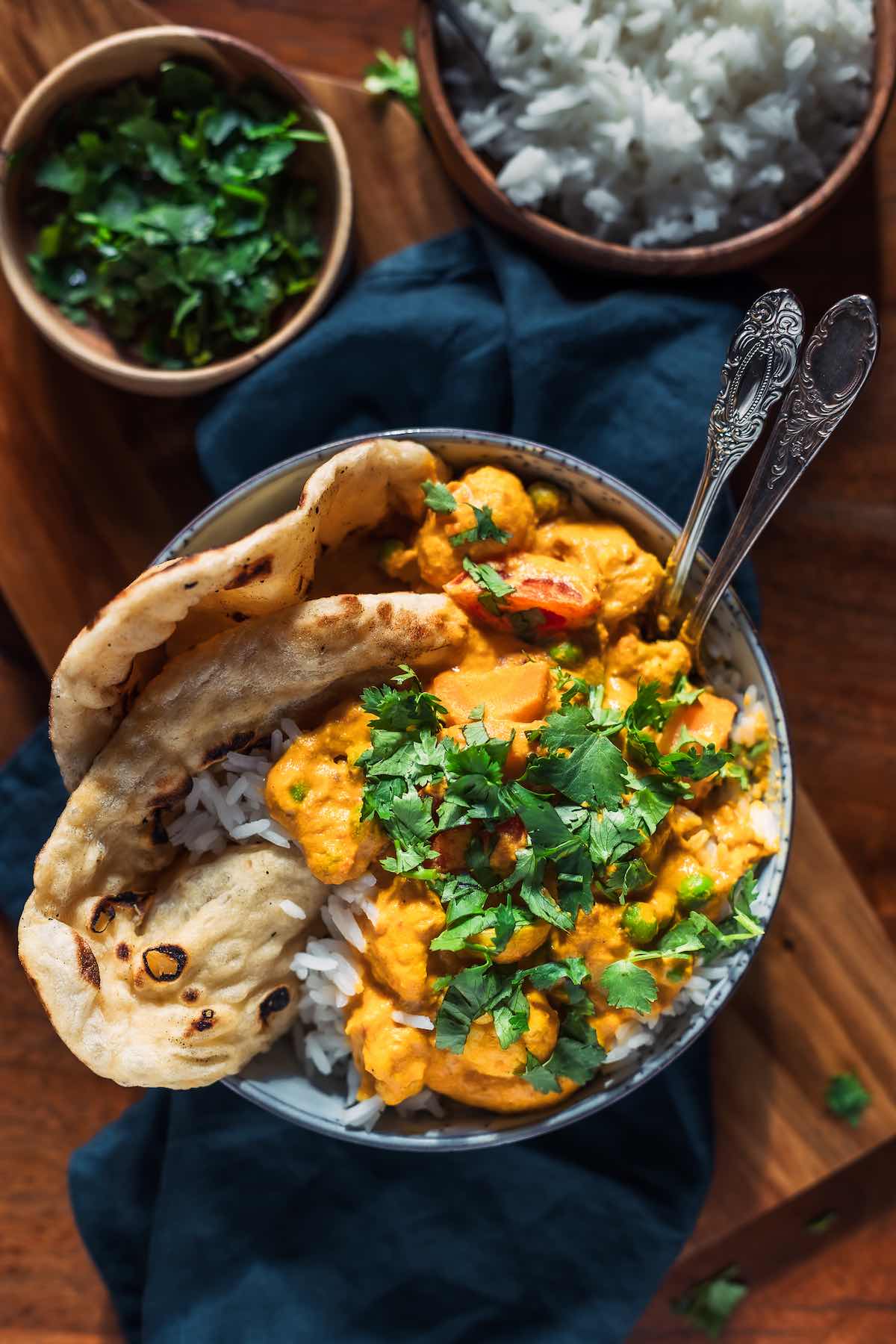 vegetable korma with fresh cilantro and naan.