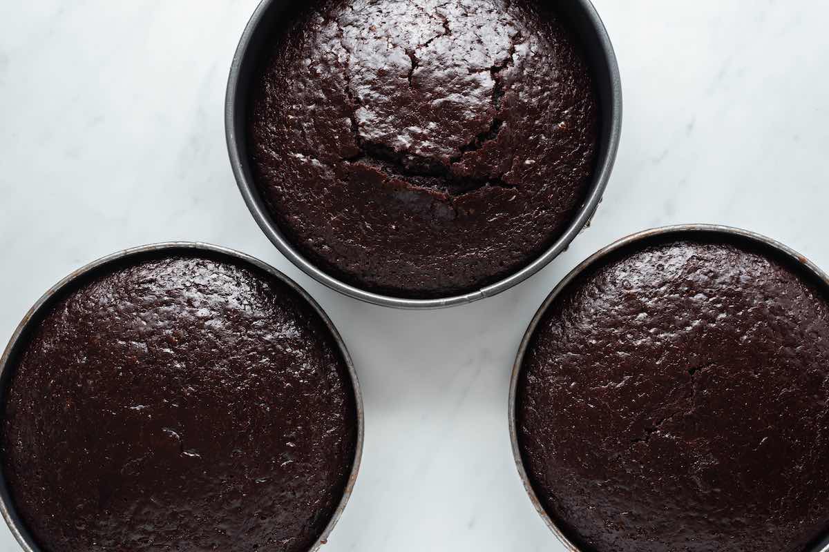 baked almond flour chocolate cakes in cake tins.