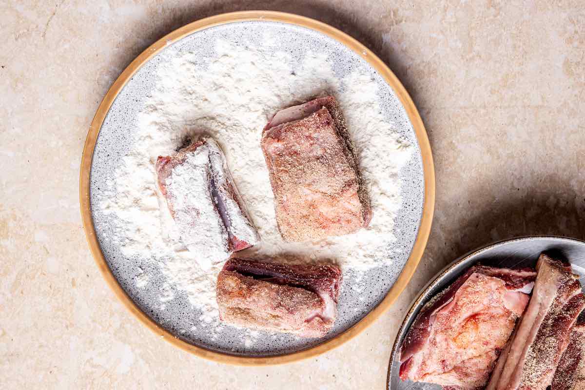 raw boneless beef short ribs tossed in flour.