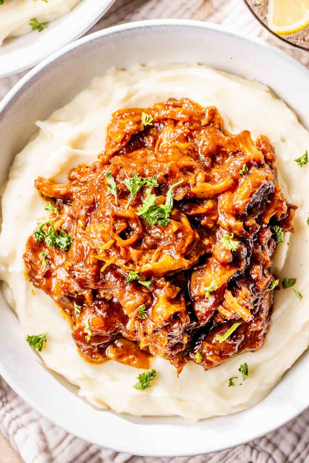 braised boneless beef short ribs over mashed potatoes.