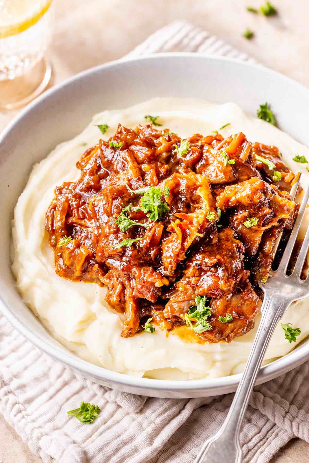 boneless beef short ribs over mashed potatoes.