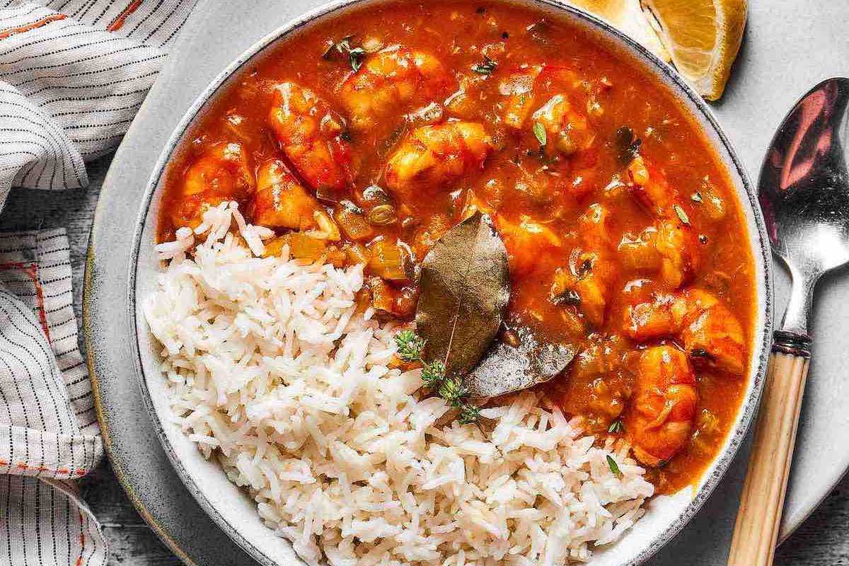 bowl of crawfish etouffee with white rice.