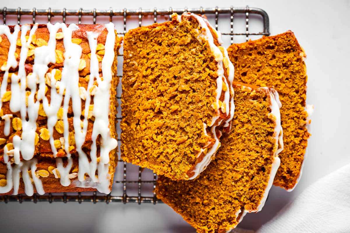 sliced pumpkin bread on a wire rack.