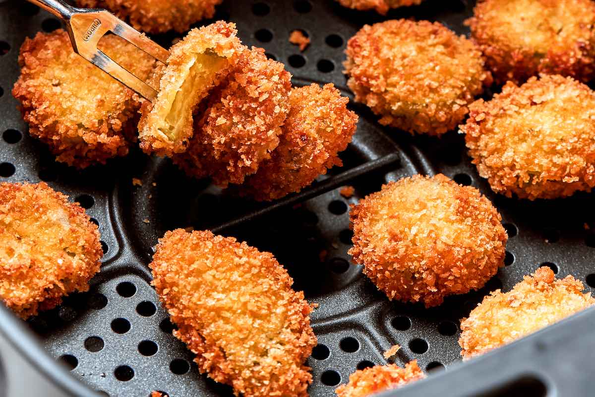 freshly air fried fried pickles in air fryer.