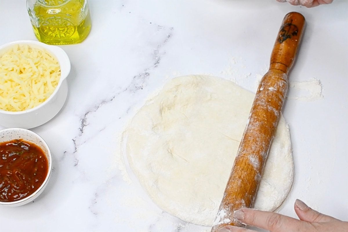 rolled out pizza dough.