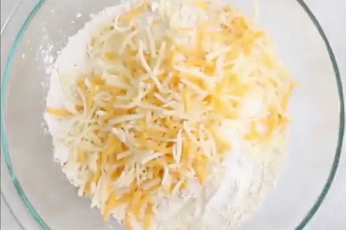 flour, cheese, and milk in bowl.