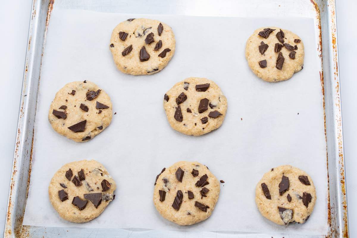 assembled cookies on a baking sheet.