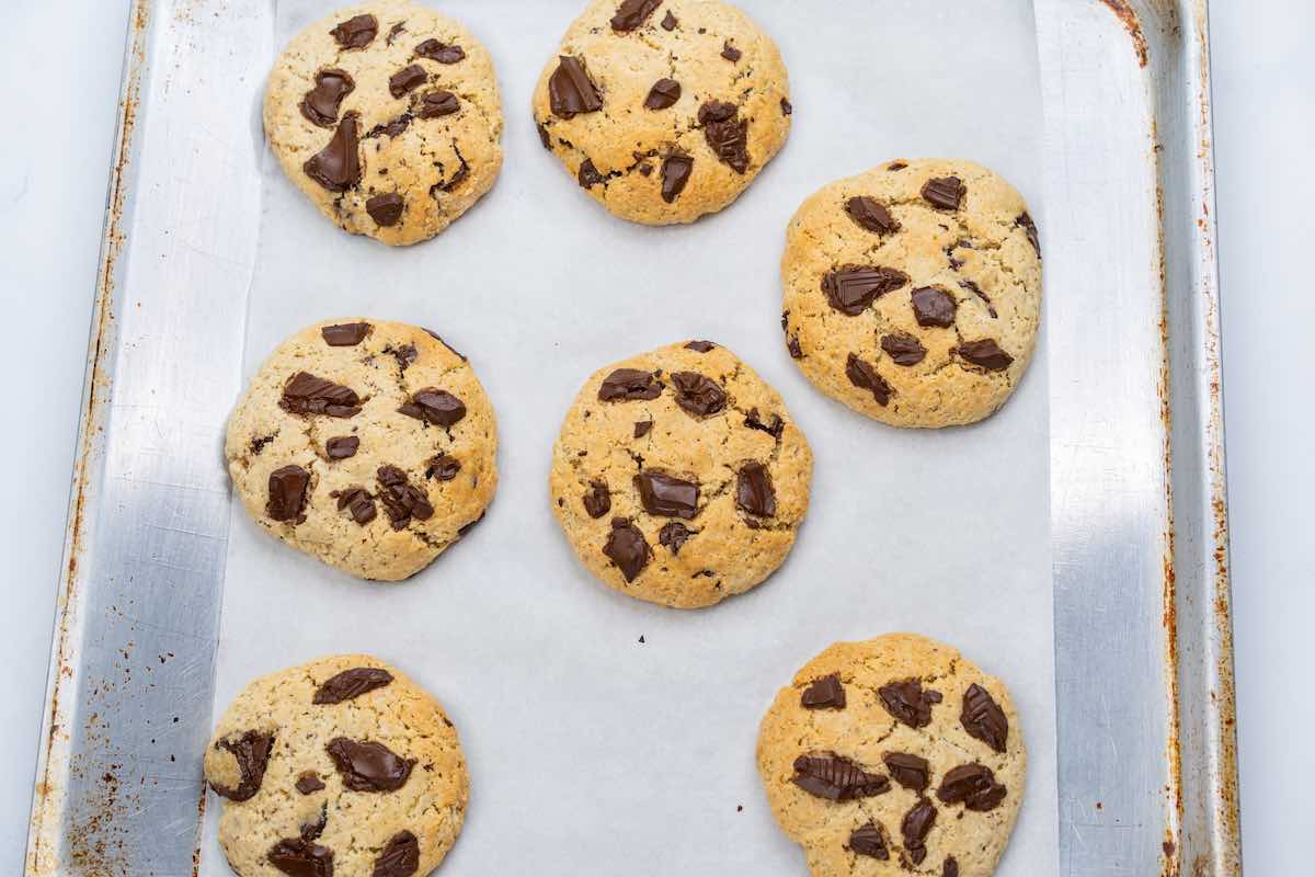 baked flourless cookies on a baking sheet.