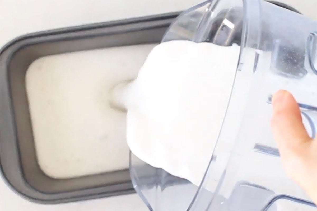 pouring ice cream mixture into loaf pan.