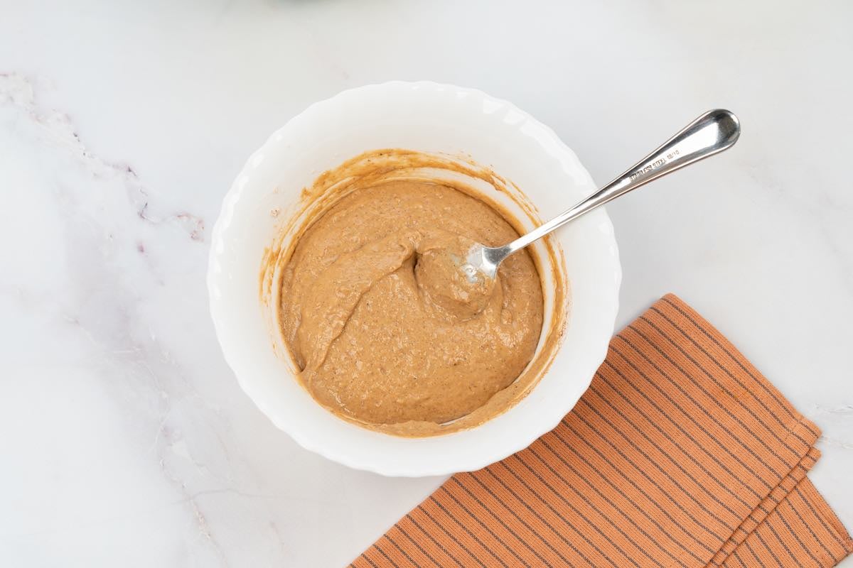 spice cake mix and pumpkin puree in a bowl.