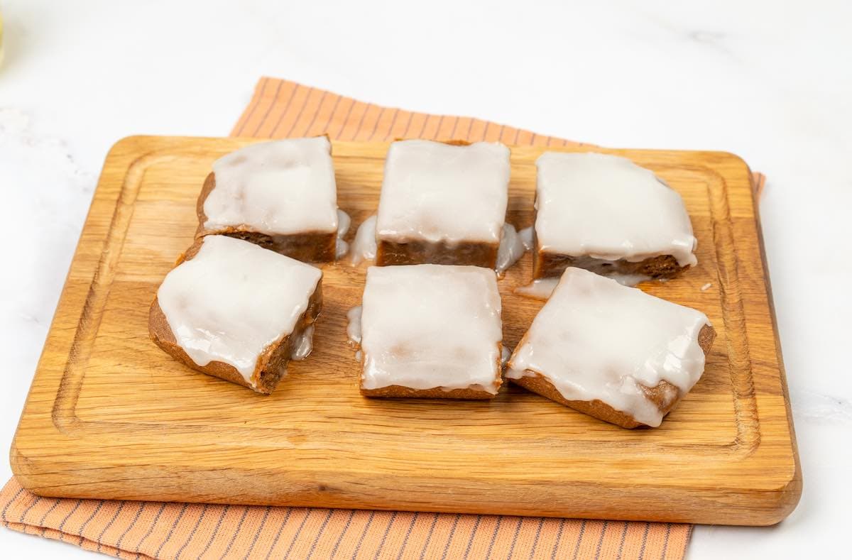 sliced pumpkin cake with glaze on top.
