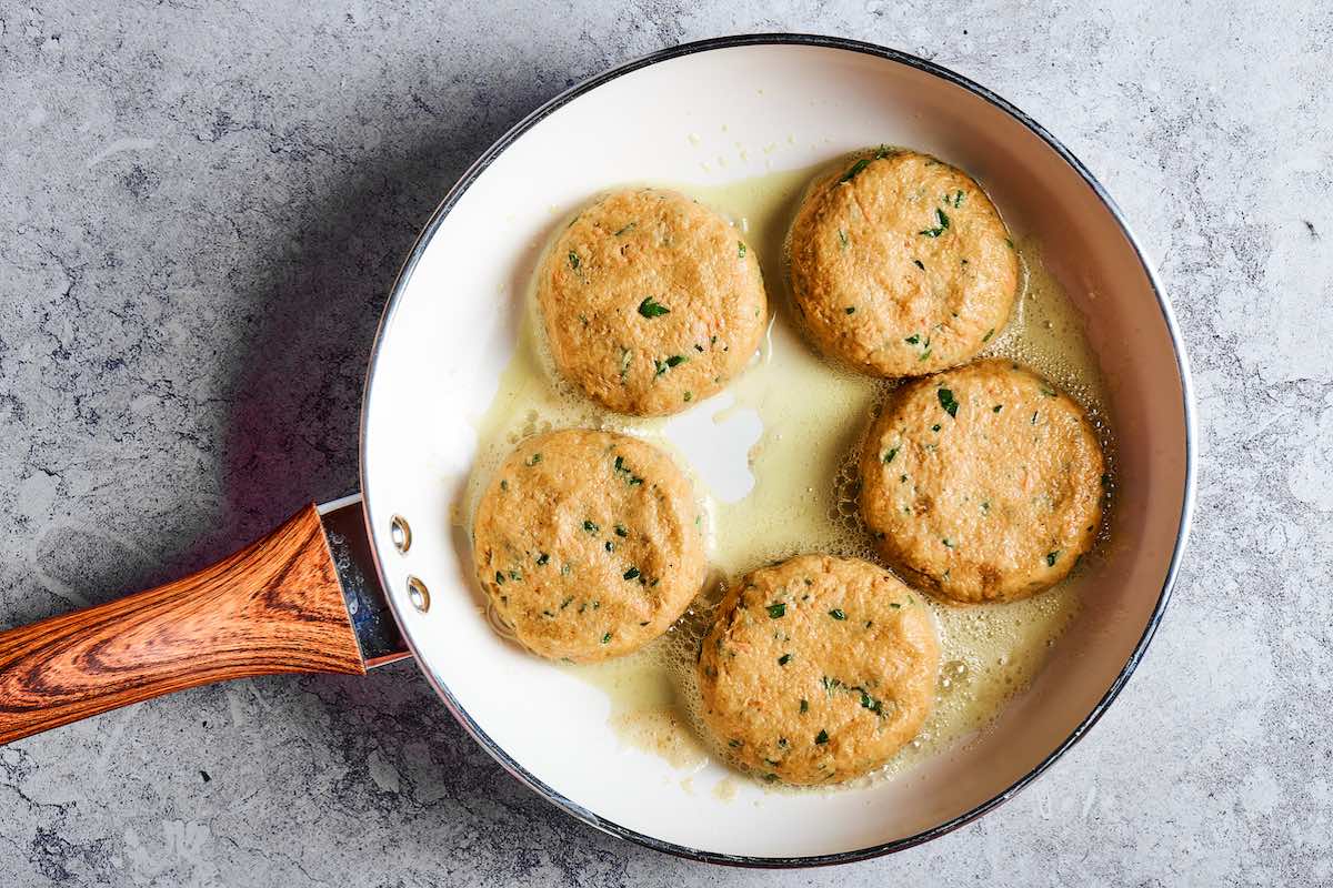 shaped patties in a skillet.