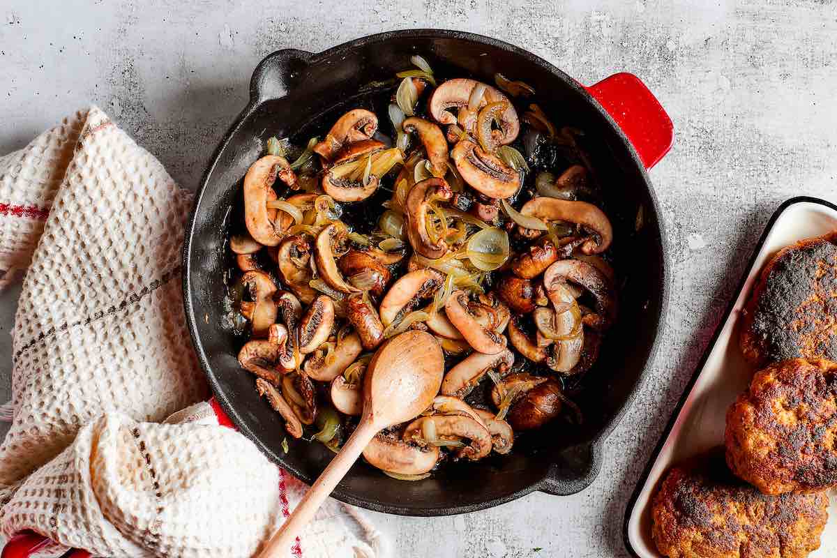 mushrooms and onions in a skillet.