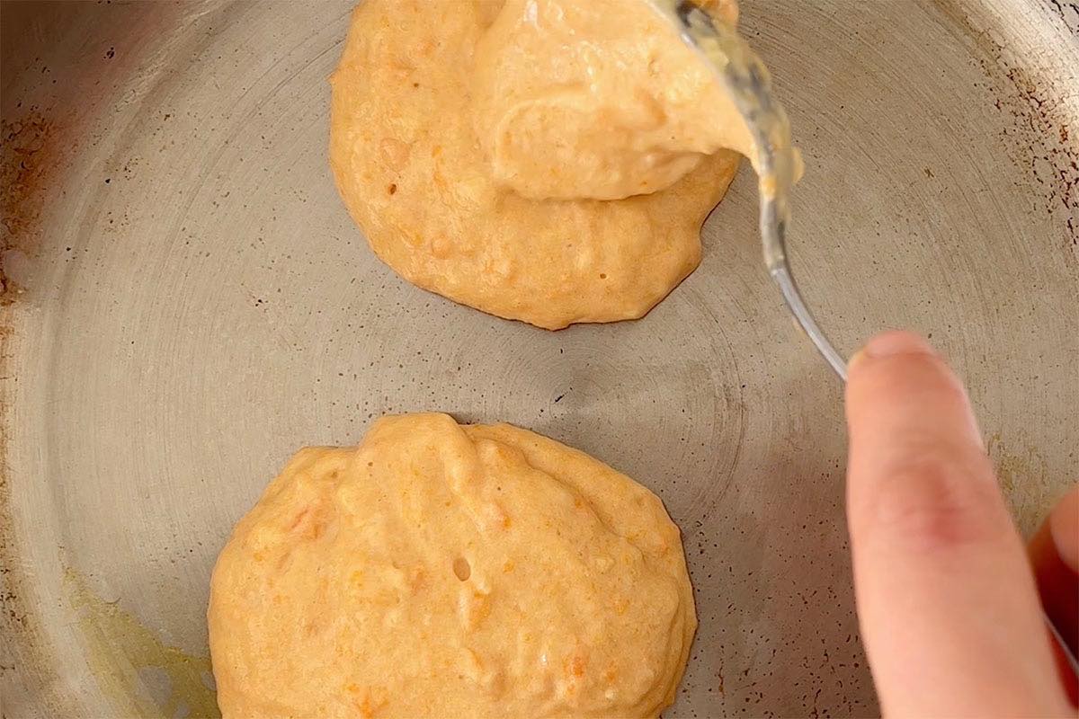 pancake batter on a hot skillet.