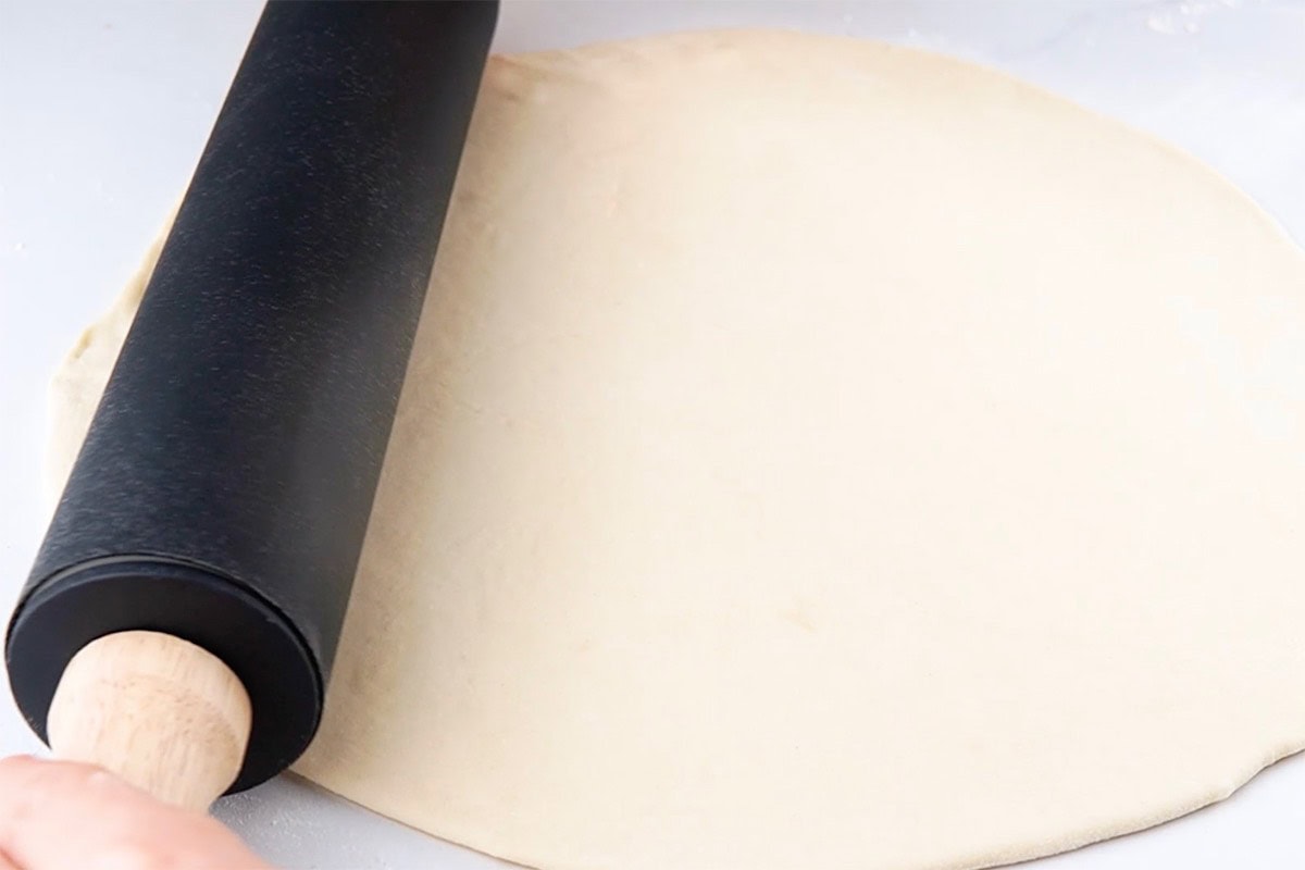 rolled out pizza dough.