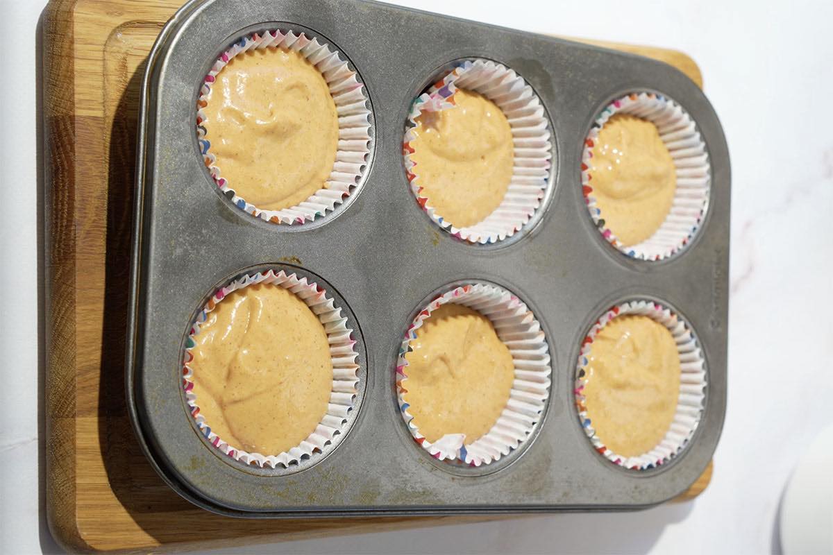 muffin batter poured in muffin liners.