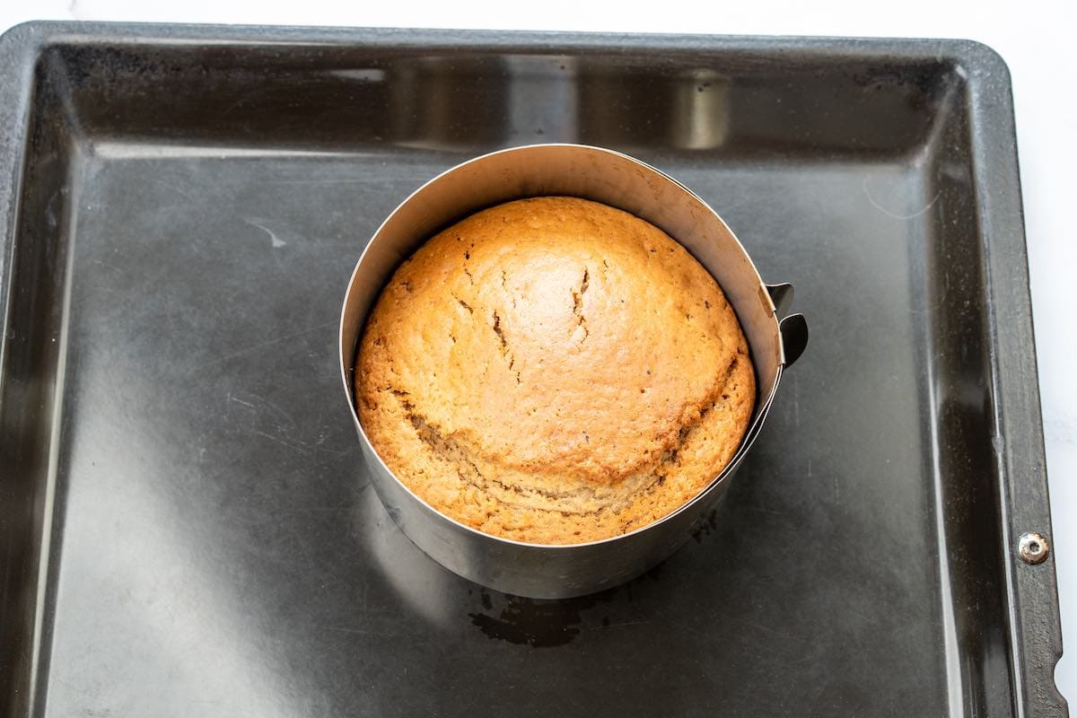 baked applesauce cake in a cake tin.