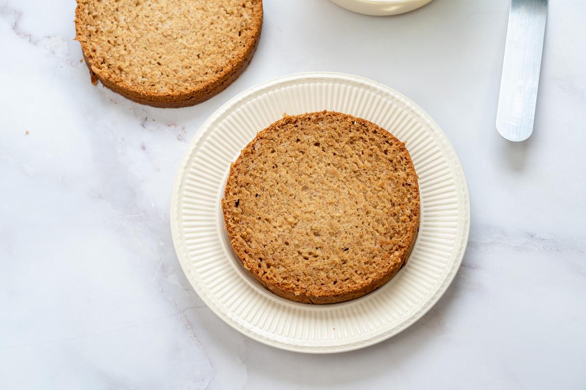 baked applesauce cake sliced down the middle.