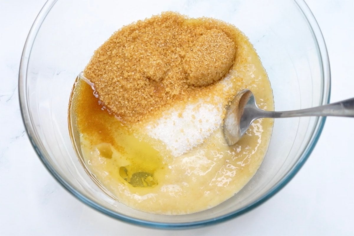 sugar, banana, and oil in mixing bowl.