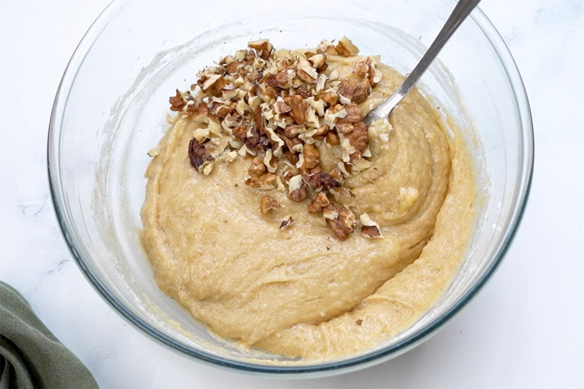 banana bread batter with pecans folded in.