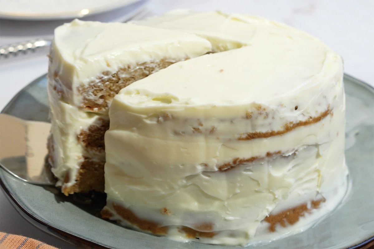 sliced and serving healthy apple cake.