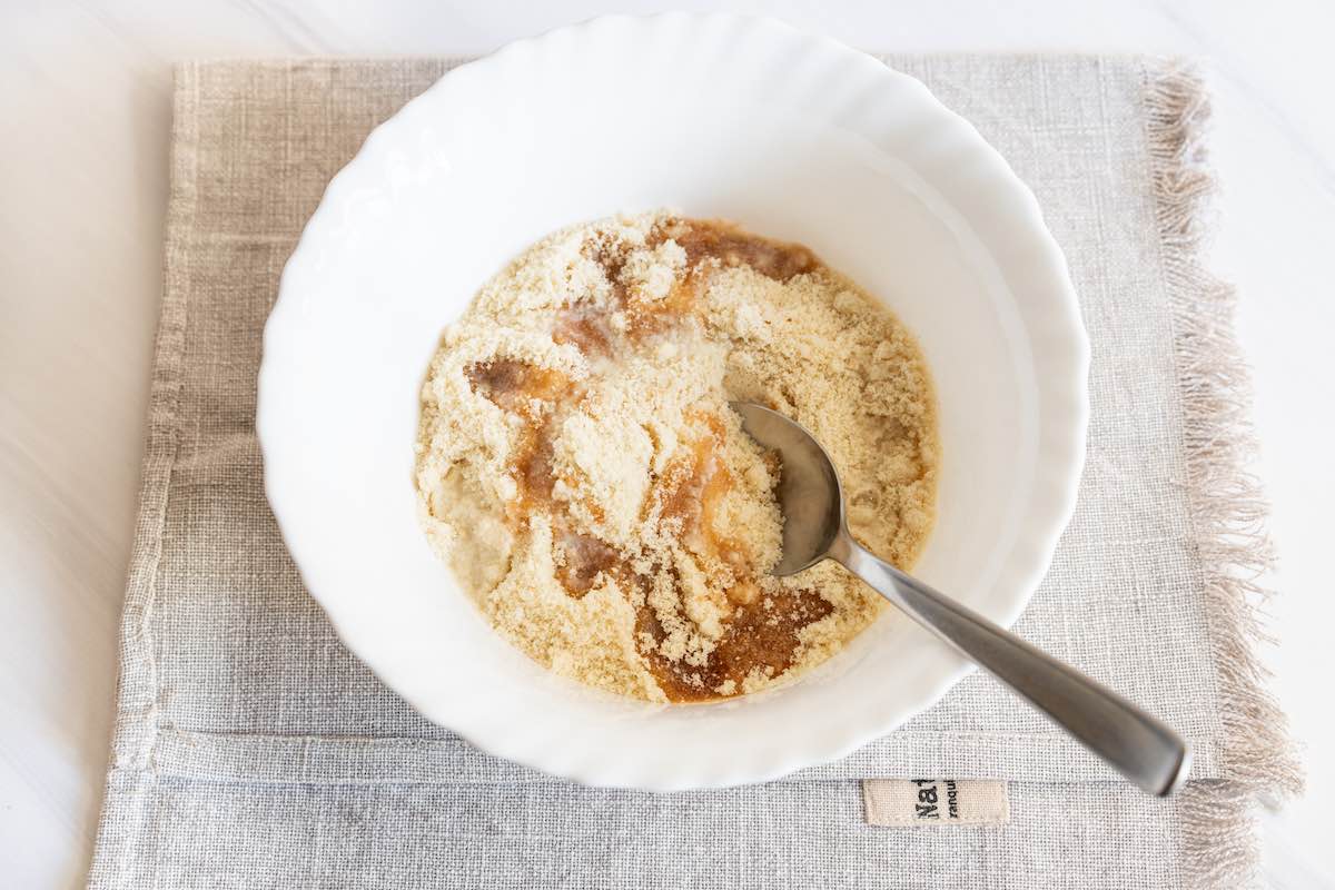 almond flour and maple syrup in bowl.