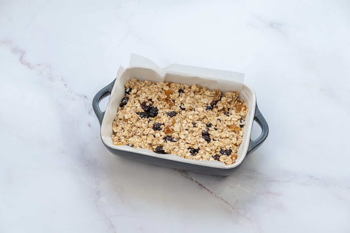 granola bar mixture in a loaf pan.