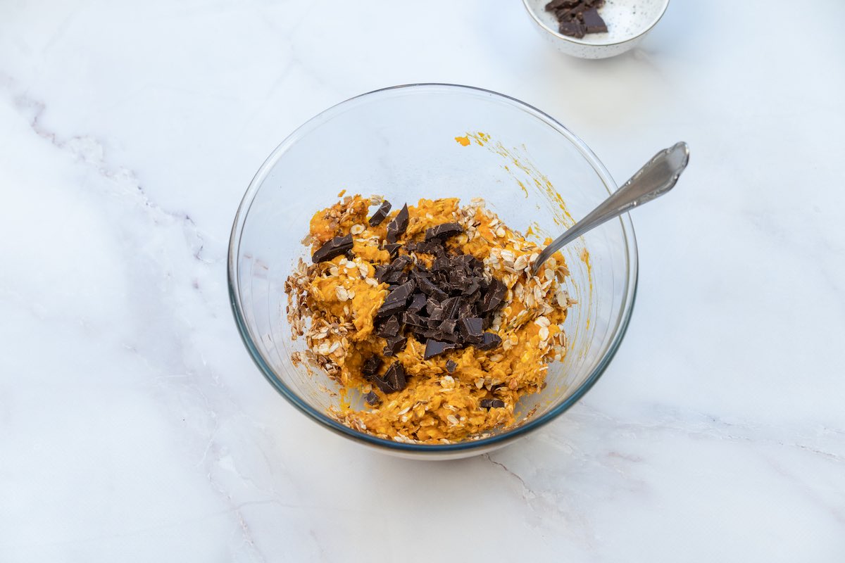 pumpkin cookie mixture in mixing bowl.