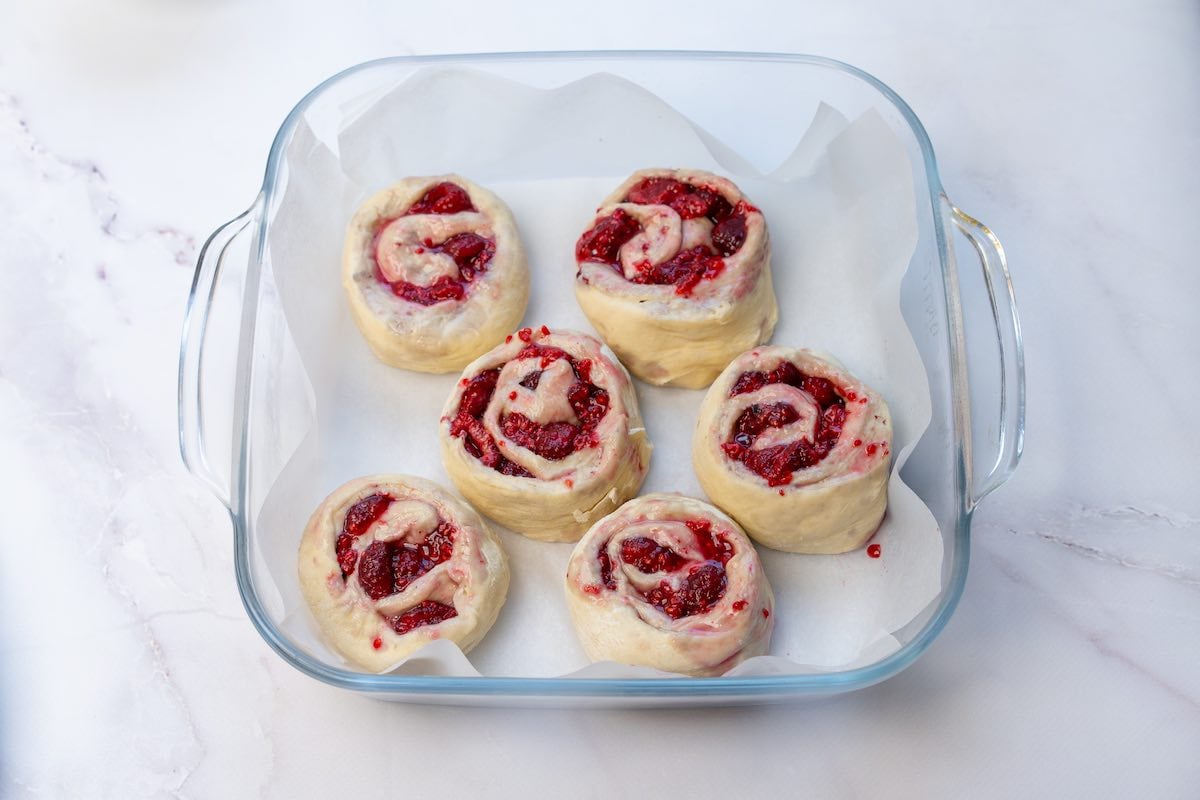 sliced rolls in a baking dish.