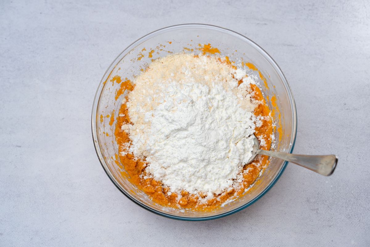 mashed sweet potato, coconut flour, and tapioca starch in a bowl.