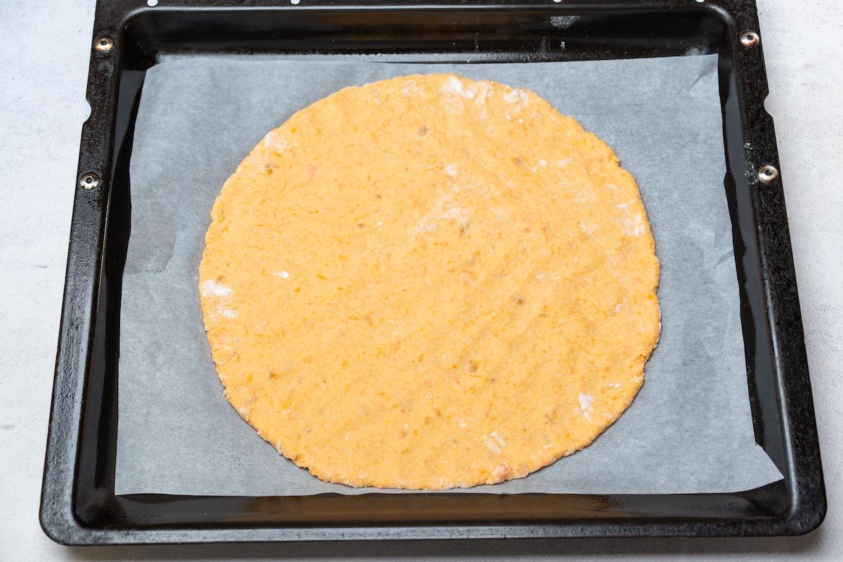 shaped sweet potato crust on parchment paper.