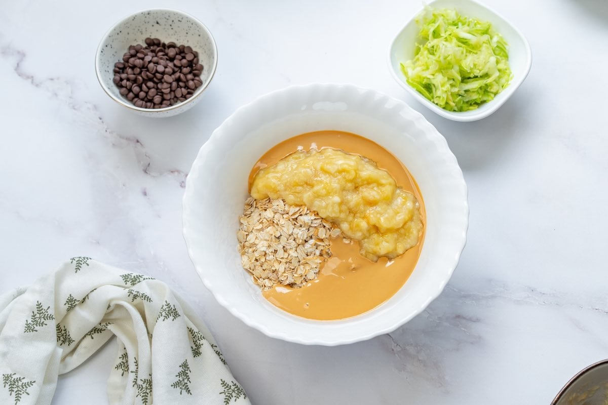 oats, mashed banana, and peanut butter in a bowl.