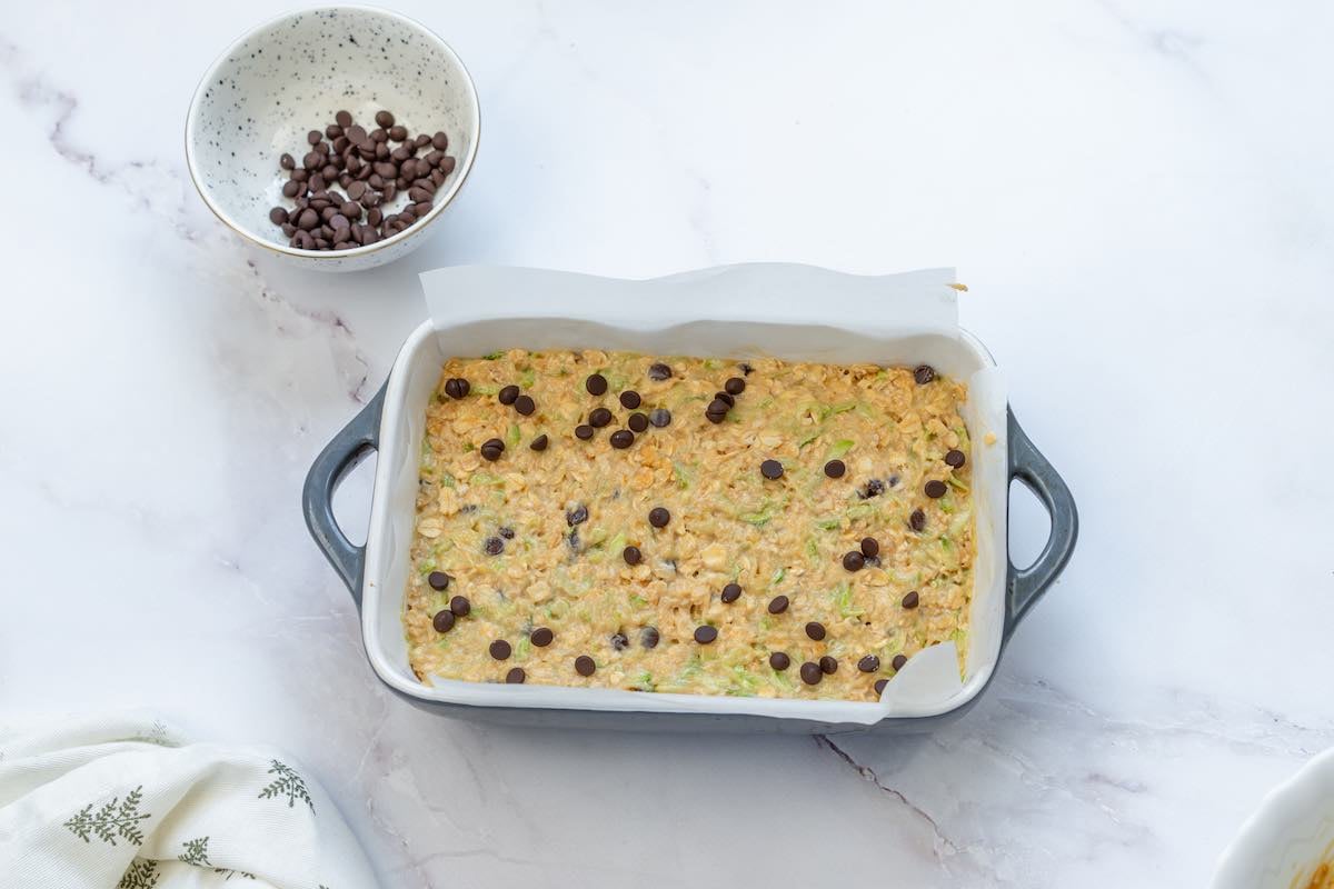 assembled zucchini bar mixture in baking dish.