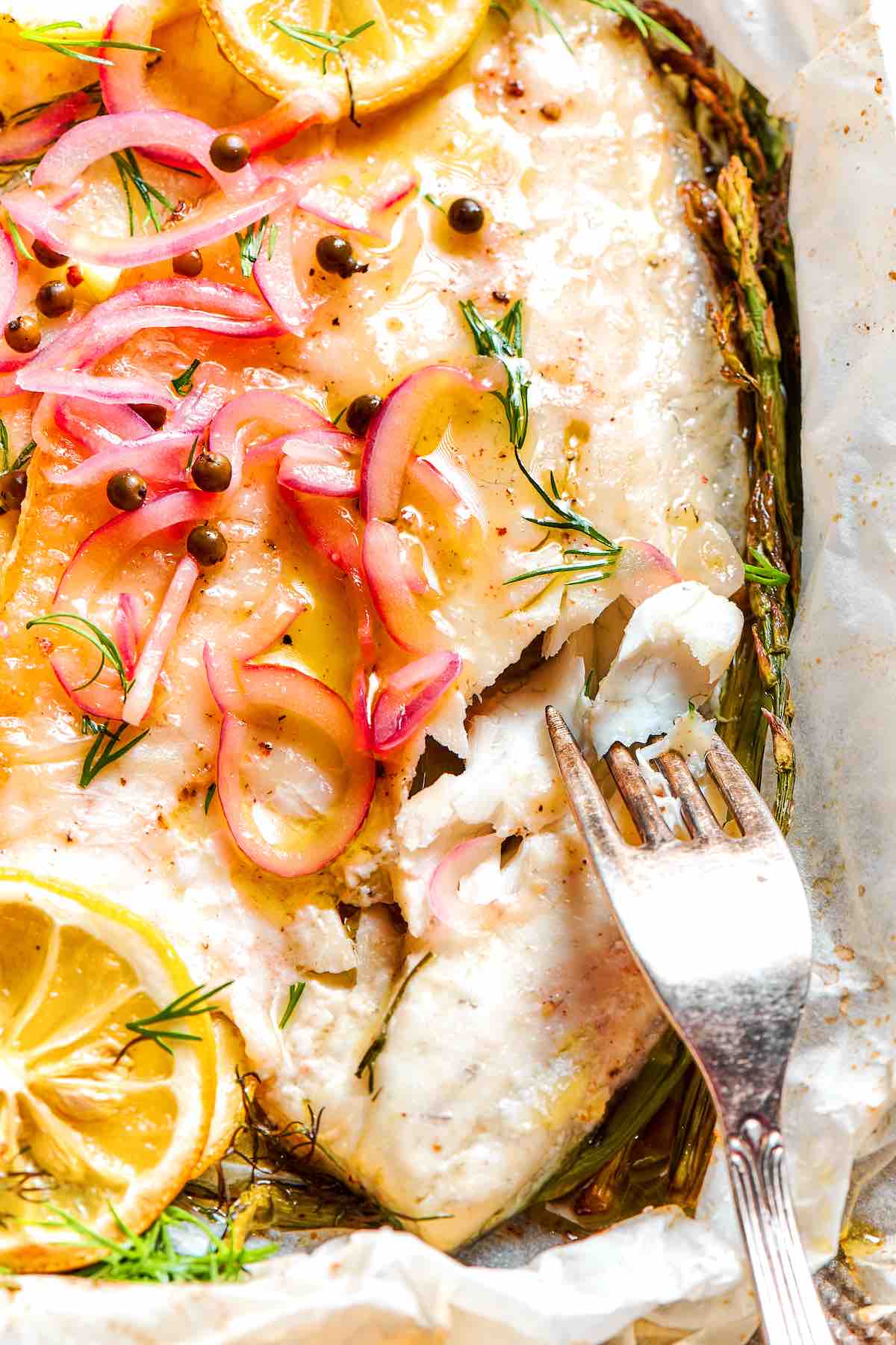 baked whiting with melted butter on top.