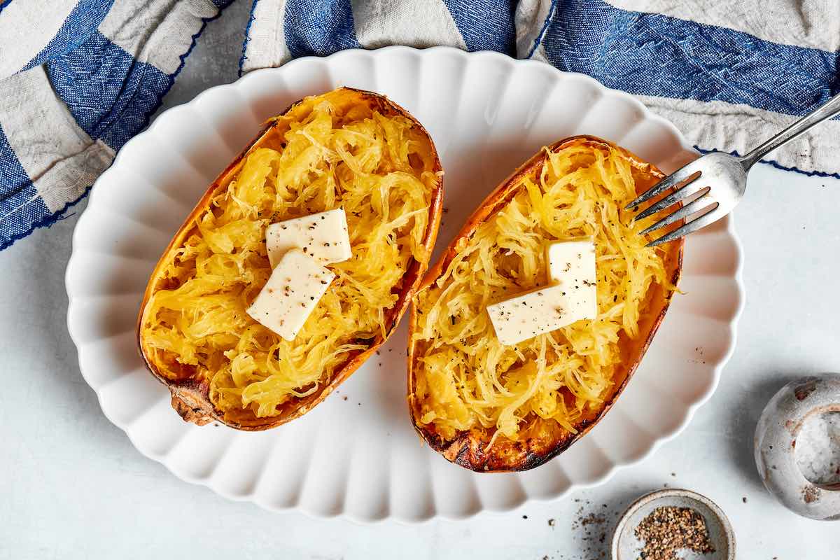 air fried spaghetti squash with pats of butter on top.
