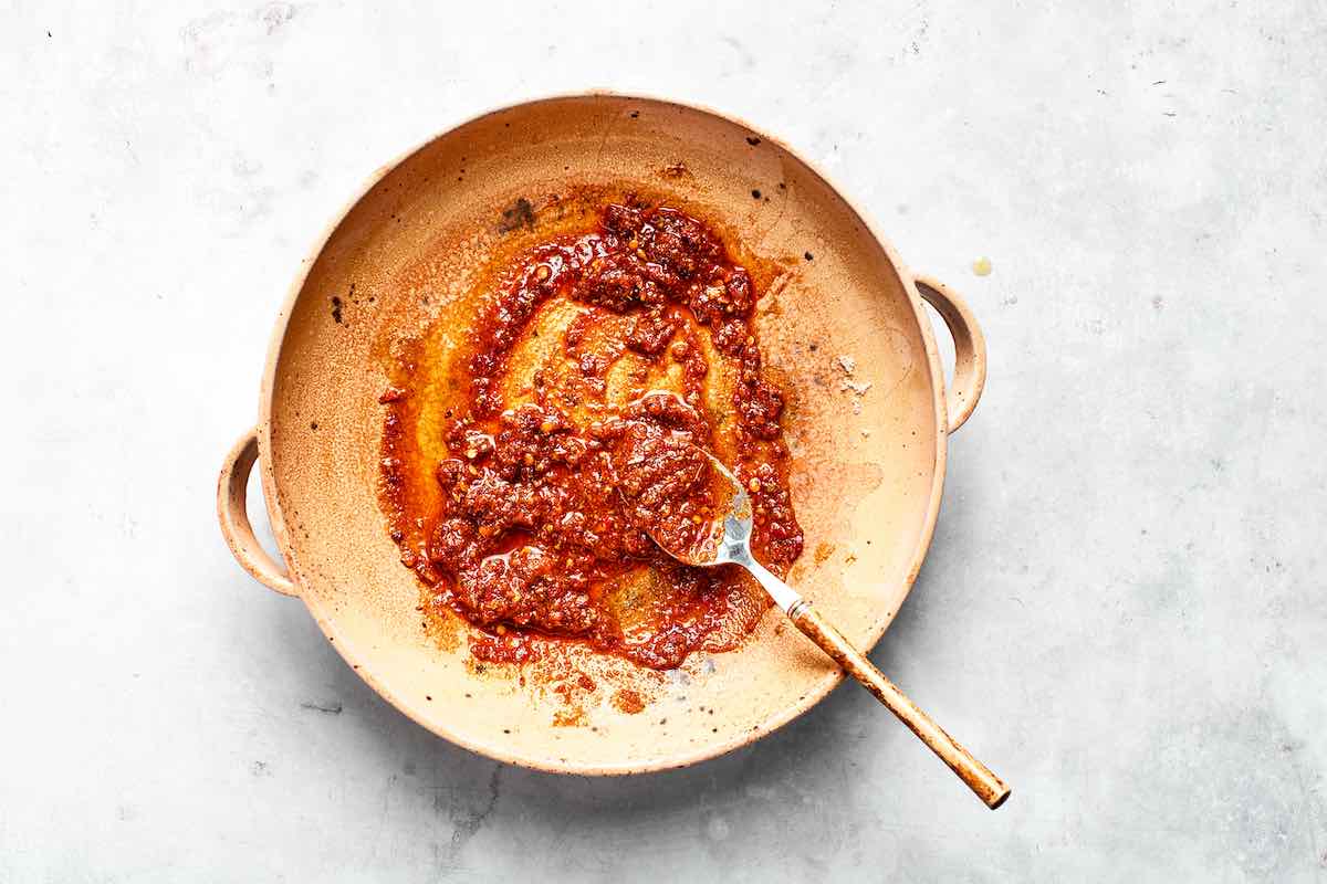 spices, lemon zest, and oil in a saucepan.