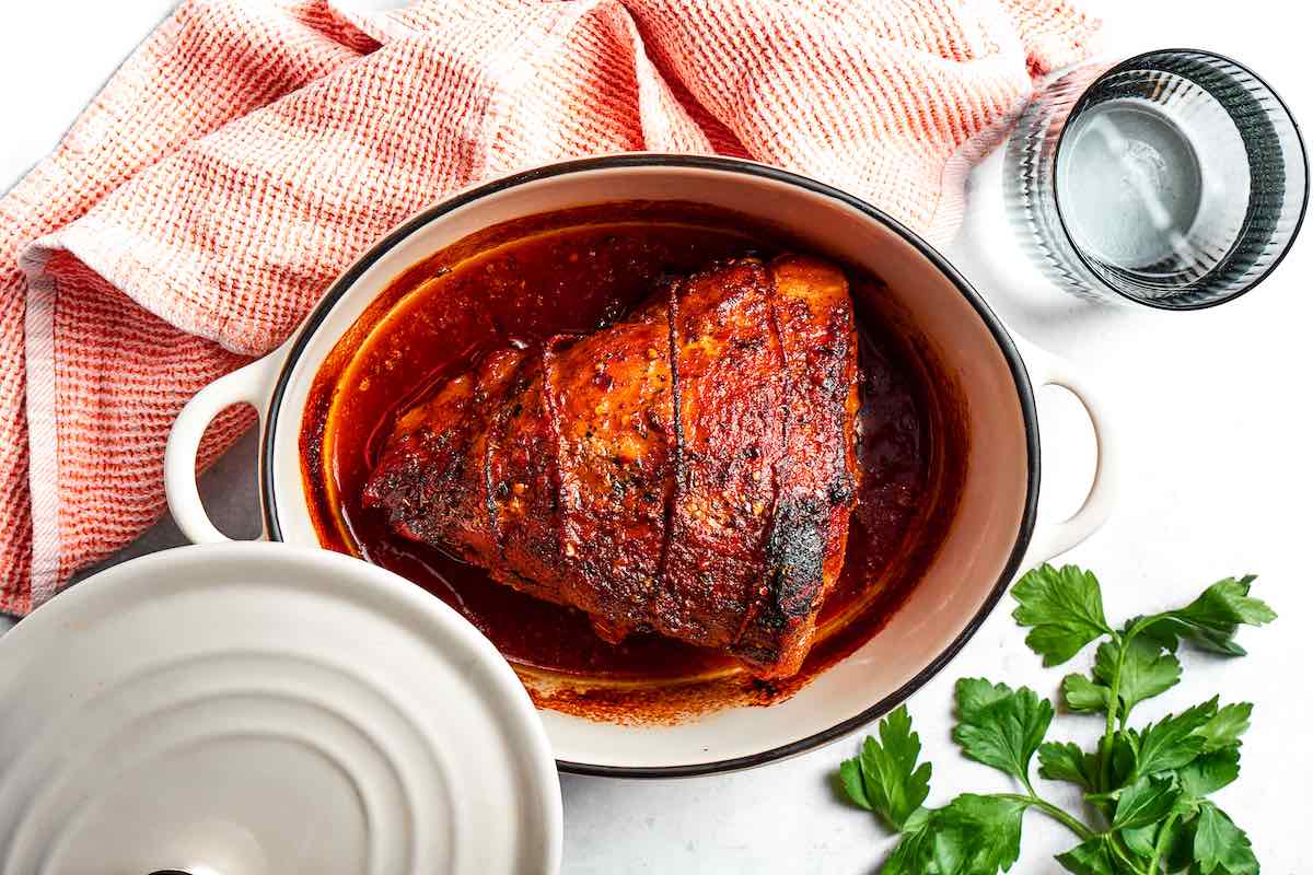 roasted pork shoulder in a Dutch oven.