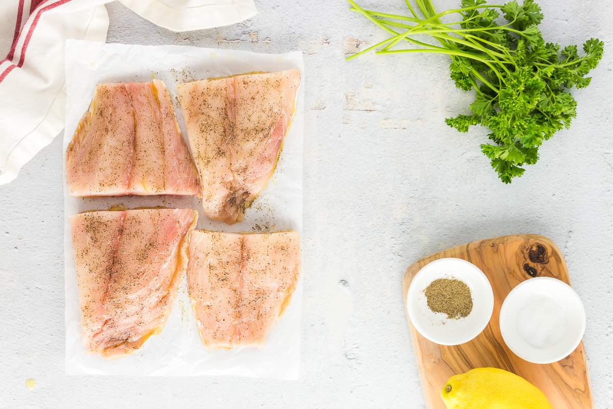 seasoned raw snapper fillets.