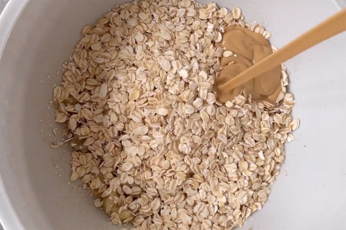 mashed bananas, oats, and peanut butter in a bowl.