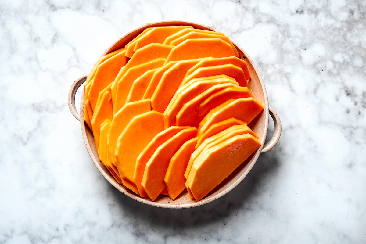 raw butternut squash sliced into 1/4-inch slices.