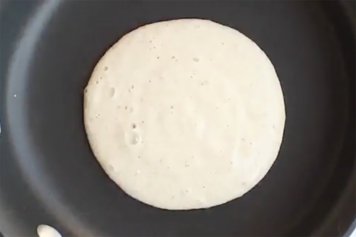 pancake batter on a hot pan.