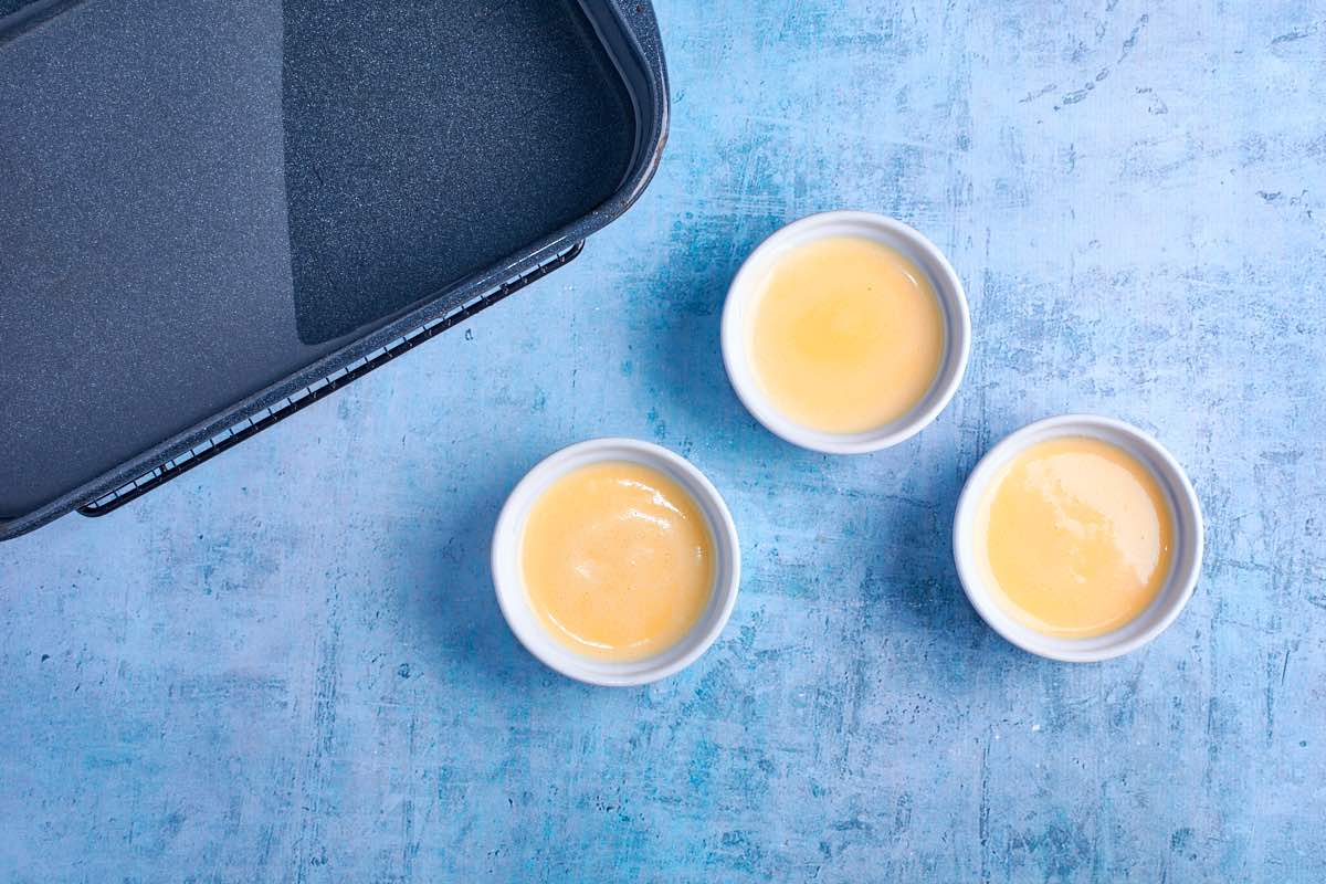 assembled creme brulees in ramekins.