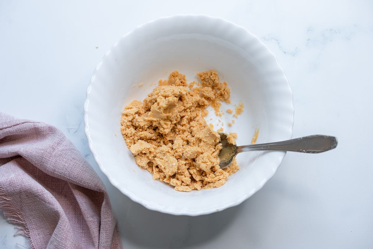 coconut flour, sugar free maple syrup, and peanut butter in bowl.